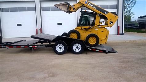 skid steer on car trailer|securing skid steer on trailer.